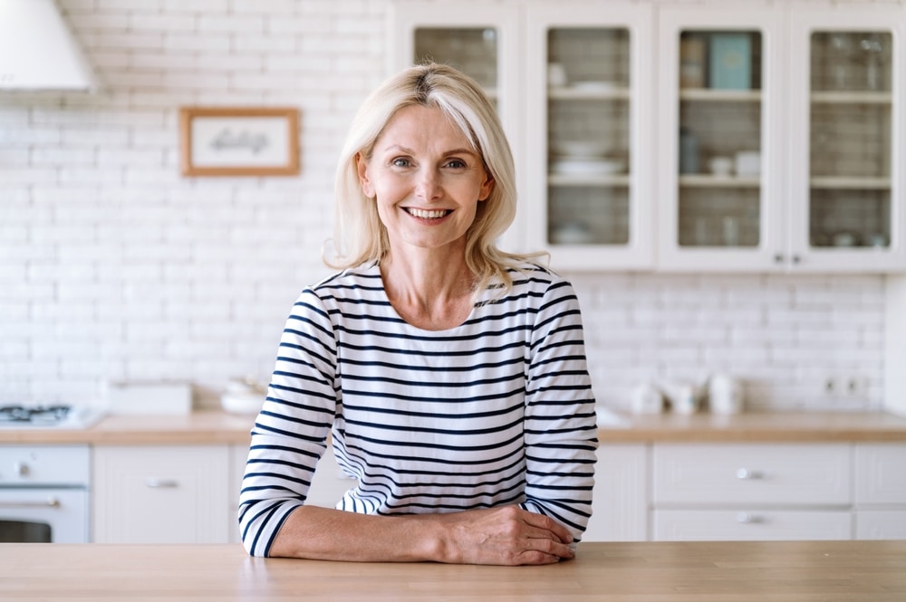 A woman's smile is healthy and bright thanks to new Dental Fillings at All Valley Dental