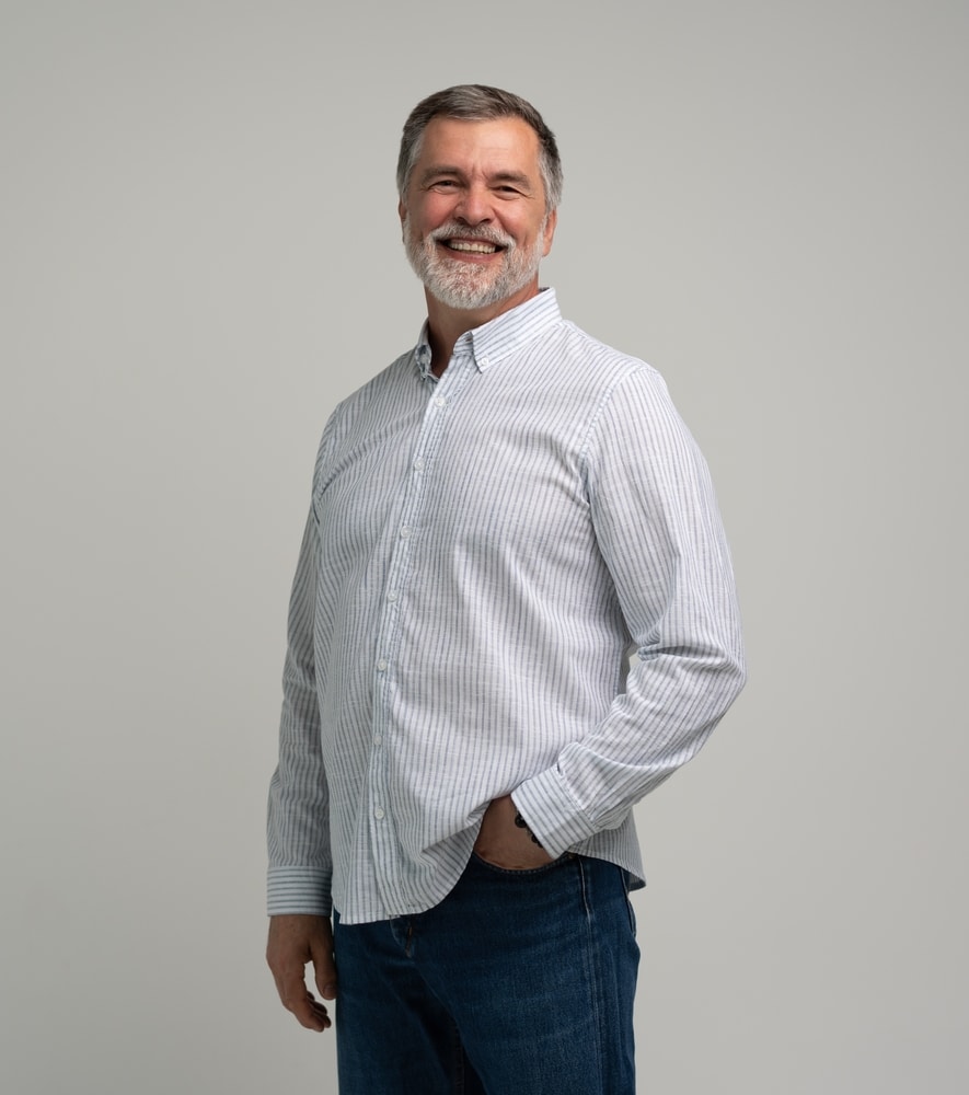 A happy patient shows his amazing smile from the Smile Gallery at All Valley Dental